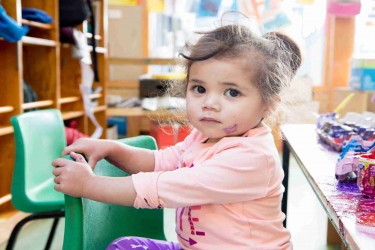 Child playing with paint. 