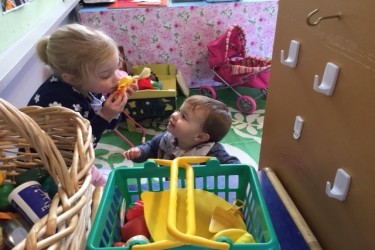 Children playing with toys. 