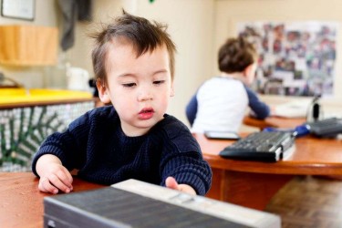 Child looking at a book. 