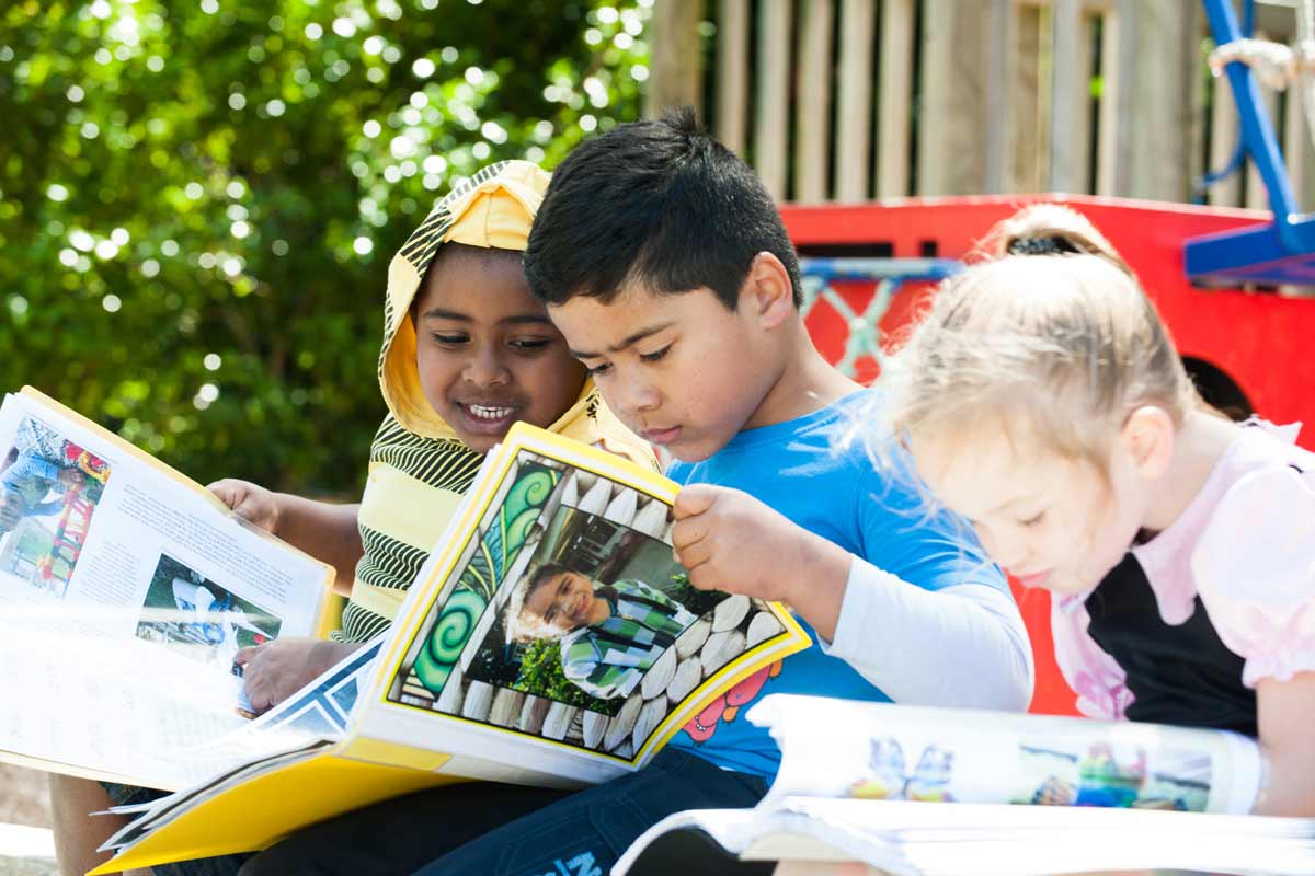 Children reading their stories together.