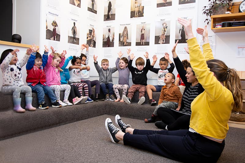 A kaiako leads a game in te reo Māori.